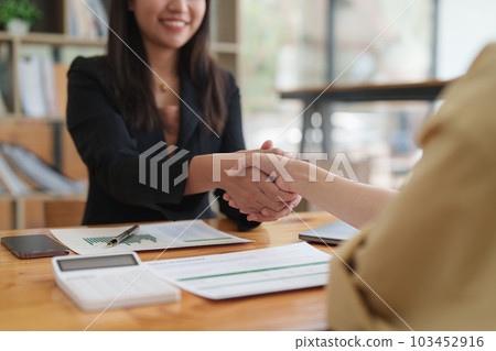 Business people handshake. Successful businessmen handshaking after good deal. Finishing up meeting concept 103452916