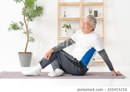 Man twisting his stomach Stretching 103453258
