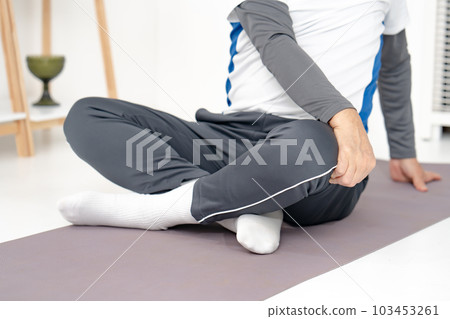 Man twisting his stomach Stretching 103453261