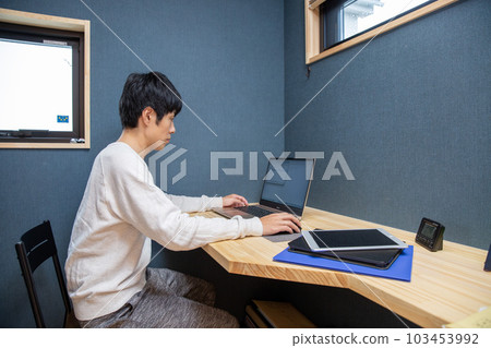 Japanese man working at home workspace Japanese man working at home workspace 103453992
