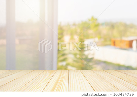 Empty wood table top with window curtain abstract blur background for product display 103454759