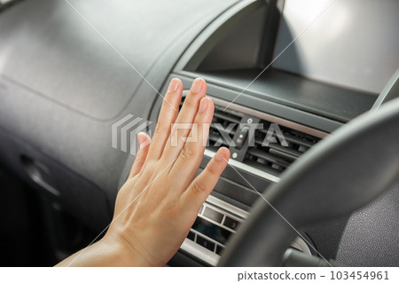 hand checking air conditioner system inside the car hand checking air conditioner system inside the car 103454961