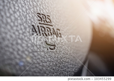 Safety airbag sign on car steering wheel with horn icon 103455299