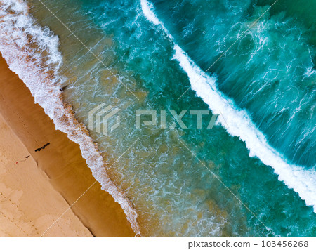 Aerial view of sea crashing waves White foaming waves on beach sand, Top view beach seascape view,Amazing nature sea ocean background Aerial view of sea crashing waves White foaming waves on beach sand, Top view beach seascape view,Amazing nature sea ocean background 103456268