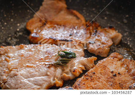 Pork steak baked in a frying pan 103456287