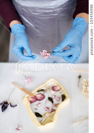 Epoxy Resin Art. Creating Art with Resin on workshop. The art process of creating epoxy resin handmade staff in art studio. 103456996