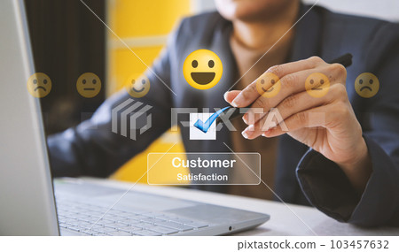 Close up of man hand pressing on smartphone screen with customer positive think, smile mental review. Customer satisfaction concept Close up of man hand pressing on smartphone screen with customer positive think, smile mental review. Customer satisfaction concept 103457632