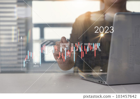 Businessman analyzes profitability of working companies with calculates financial data for long-term investments. positive indicators in 2023 concept 103457642