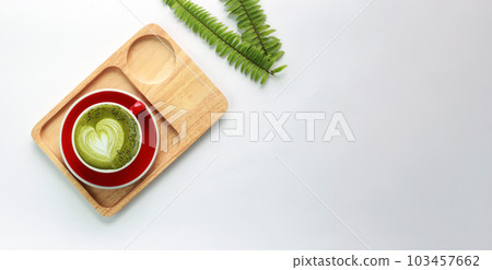 Green tea latte on a cup of white table. top view Green tea latte on a cup of white table. top view 103457662