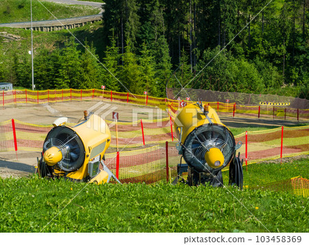 Snowblowers on the ski slope Snowblowers on the ski slope 103458369