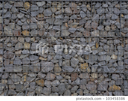 Decorative fence of bulk stone in the grid Decorative fence of bulk stone in the grid 103458386