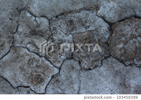Dark gray background with cracks and hollows Dark gray background with cracks and hollows 103458399