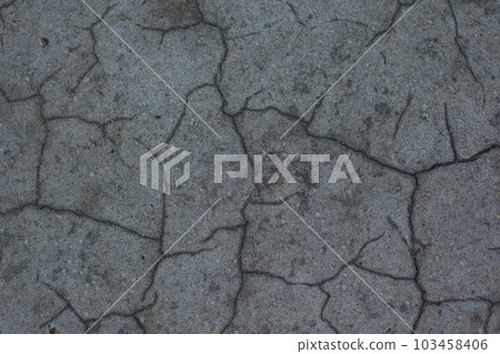 Dark gray background with cracks and hollows Dark gray background with cracks and hollows 103458406
