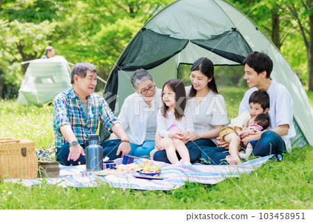 Three generation family enjoying camping Three generation family enjoying camping 103458951
