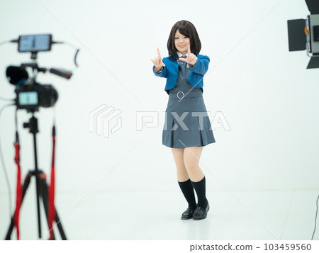 A high school girl taking a picture of a dance 103459560