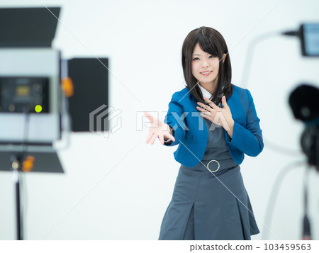 A high school girl taking a picture of a dance 103459563