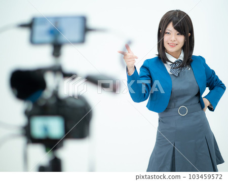 A high school girl taking a picture of a dance A high school girl taking a picture of a dance 103459572