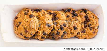 cookies with chocolate and hazelnuts on a white background 103459709