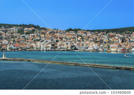 1813 stone-built water-surrounded obelisk next to De Bosset Bridge with Argostoli town panorama in the background on the Ionian Island of Cephalonia Greece. 103460600