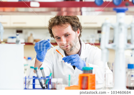 Male researcher doing research experiment in a chemistry lab, concept of chemist laboratory 103460684