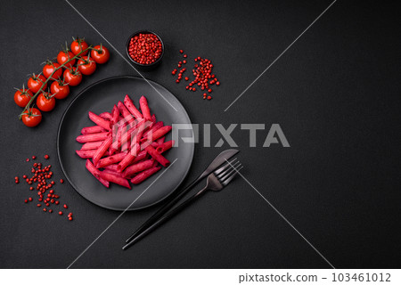 Delicious penne pasta with beets, cheese, salt and spices Delicious penne pasta with beets, cheese, salt and spices 103461012