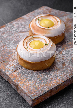 Delicious tart with citrus filling and walnut cream Delicious tart with citrus filling and walnut cream 103461070