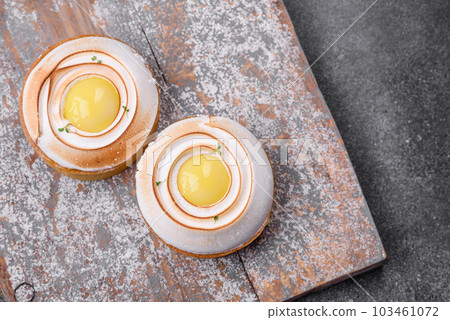 Delicious tart with citrus filling and walnut cream Delicious tart with citrus filling and walnut cream 103461072