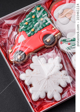 Delicious Christmas gingerbread cookies on a dark textured concrete background 103461114