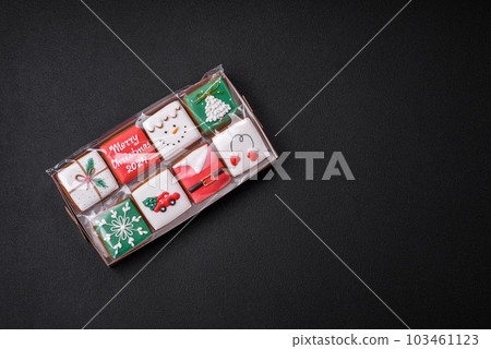 Delicious Christmas gingerbread cookies on a dark textured concrete background 103461123