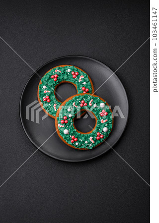 Delicious Christmas gingerbread on a dark textural background 103461147