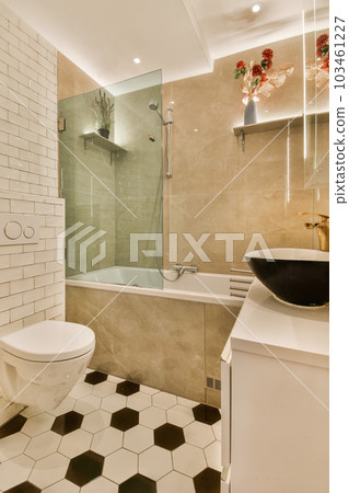 a bathroom with a black and white checkered tile floor, toilet, sink, mirror, and shower stall 103461227