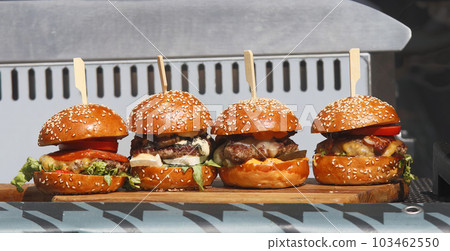 A variation of burgers displayed in a snack stand at the Karlin Street Food Festival in Prague. A variation of burgers displayed in a snack stand at the Karlin Street Food Festival in Prague. 103462550