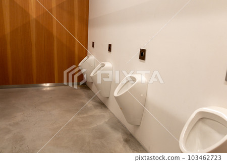 Public male toilet a line of urinals Public male toilet a line of urinals 103462723