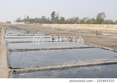 raw salt farm plot with water and polythene bed 103465910