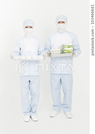 Men and women in protective clothing with food 103466681