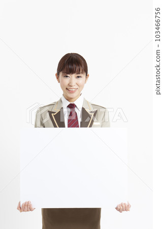 A woman in uniform holding a message board A woman in uniform holding a message board 103466756