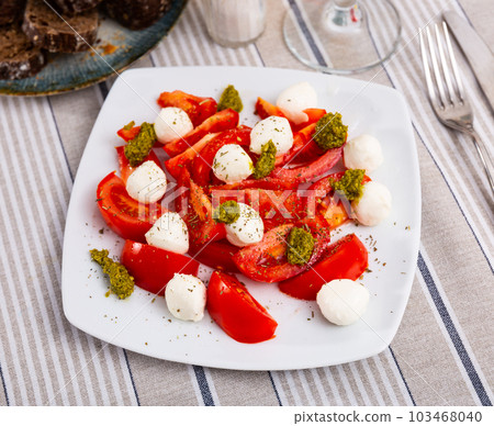 Caprese is a popular snack of Italian cuisine Caprese is a popular snack of Italian cuisine 103468040