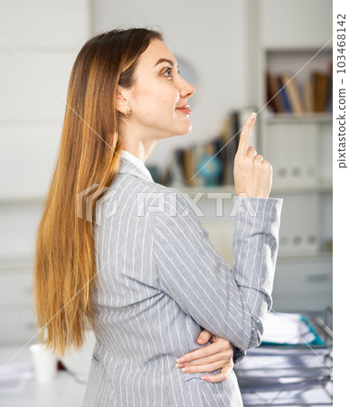 Business woman expresses different emotions while working in office 103468142