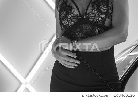 Black and white cool woman's torso and arms 103469120