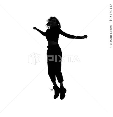 Silhouette of a foreign woman jumping 103470442