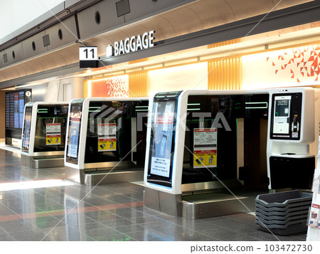Automatic baggage drop machine at Haneda Airport, Tokyo 103472730