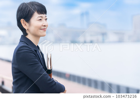 Global middle-aged female businesswoman Global middle-aged female businesswoman 103473216