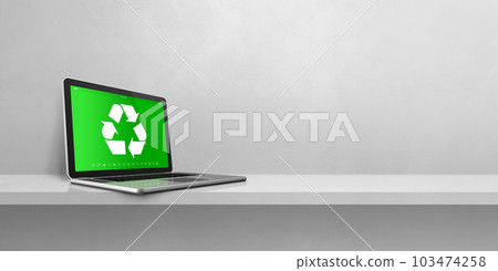 Laptop computer on a shelf with a recycling symbol on screen. environmental conservation concept Laptop computer on a shelf with a recycling symbol on screen. environmental conservation concept 103474258