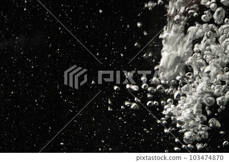 Underwater air bubbles black background 103474870
