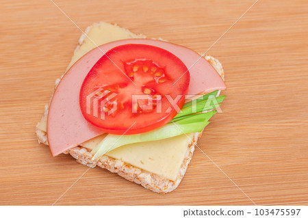 Rice Cake Sandwich with Tomato, Sausage, Green Onions and Cheese Rice Cake Sandwich with Tomato, Sausage, Green Onions and Cheese 103475597