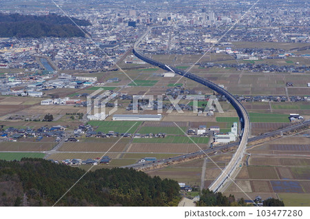 View from Mt. Monju towards the center of Fukui City Hokuriku Shinkansen under construction March 2023 103477280