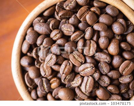 brown arabica coffee bean roast level medium taste delicate lively bright seed caffeine espresso drink food cafe beverage Chiang Rai, Thailand coffee on wooden table background top view selected focus 103478175
