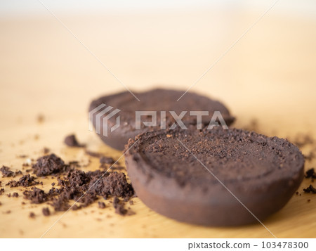 coffee grounds after bean extraction espresso machine perfect cookie powder pile brown roasted dark black drink caffeine food fresh ingredient beverage on wooden table background selected focus coffee grounds after bean extraction espresso machine perfect cookie powder pile brown roasted dark black drink caffeine food fresh ingredient beverage on wooden table background selected focus 103478300