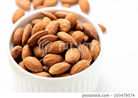 almond. Nuts that are rich in vitamin E and dietary fiber and are said to be good for beauty and health. (White background) 103479574