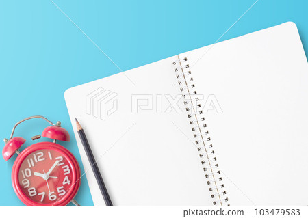 Top view with blue stethoscope, notebook, red alarm clock and pencil Top view with blue stethoscope, notebook, red alarm clock and pencil 103479583
